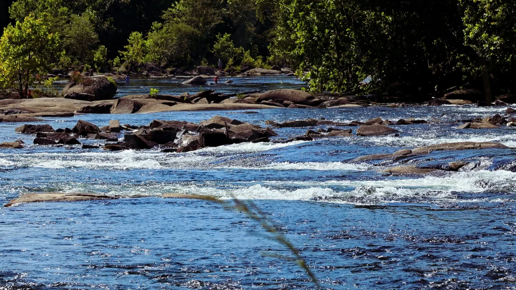 Rocky rapids flowing through the Lower Saluda River at Saluda Riverwalk in Columbia, South Carolina